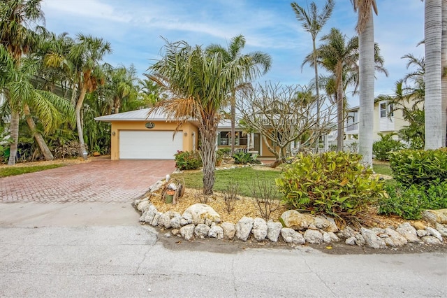 view of front of property featuring a garage