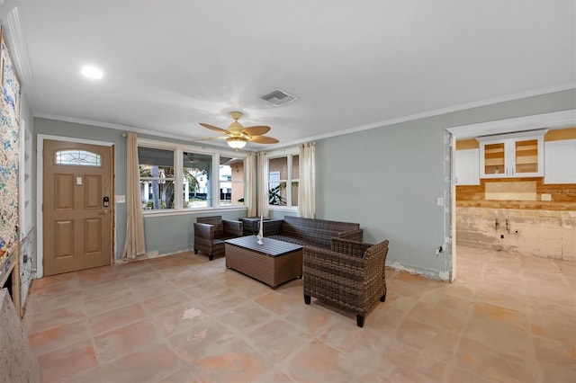 living room with crown molding and ceiling fan