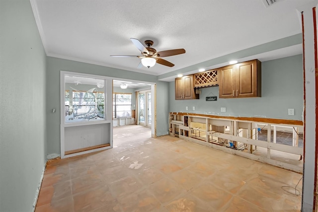 kitchen featuring ceiling fan and ornamental molding