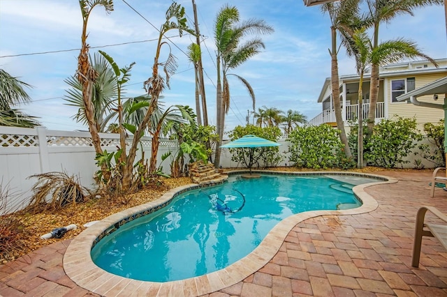 view of swimming pool with a patio area