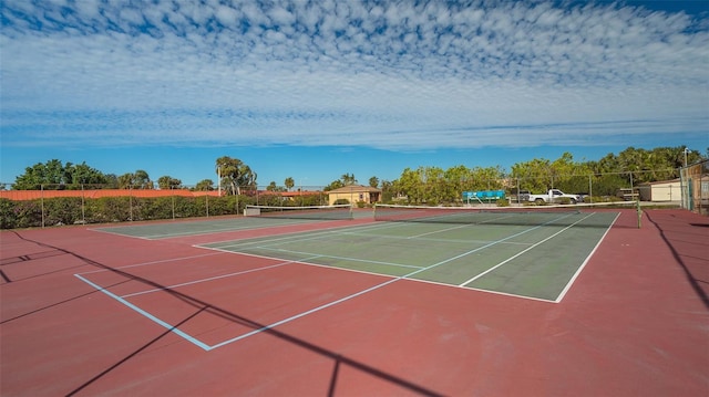 view of sport court featuring community basketball court and fence