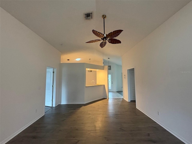 unfurnished room with high vaulted ceiling, dark hardwood / wood-style floors, sink, and ceiling fan