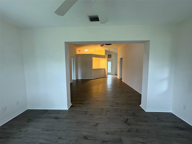 unfurnished room featuring ceiling fan and dark hardwood / wood-style floors