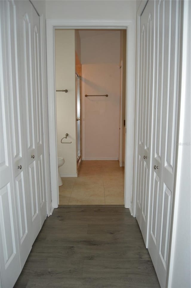 hallway featuring dark hardwood / wood-style floors