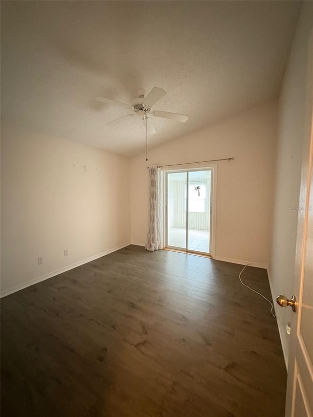 unfurnished room featuring ceiling fan and dark hardwood / wood-style floors