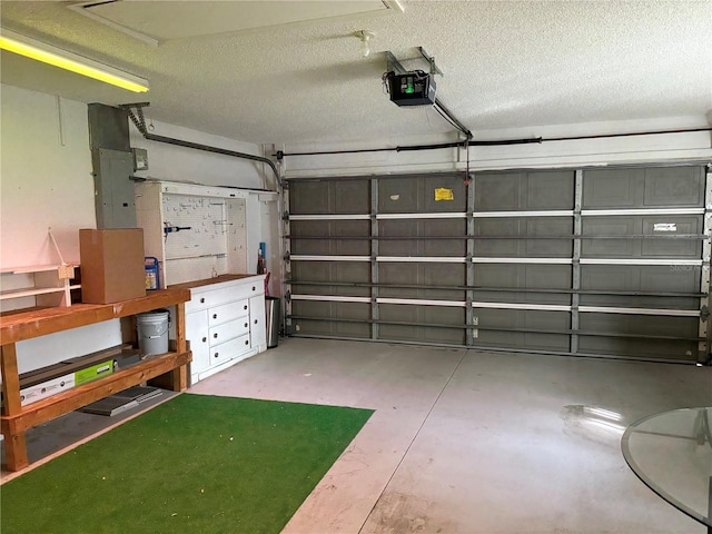 garage featuring electric panel and a garage door opener