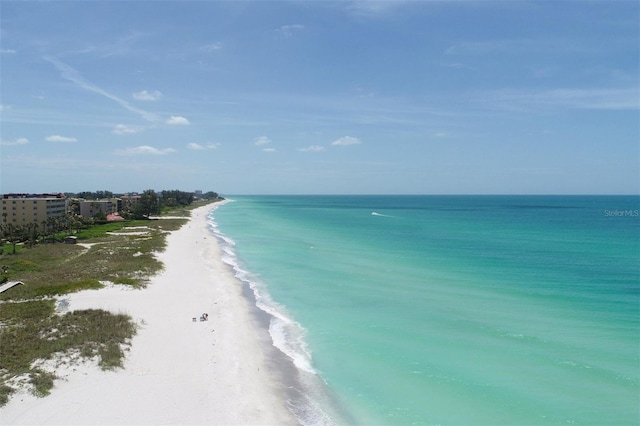 birds eye view of property featuring a view of the beach and a water view