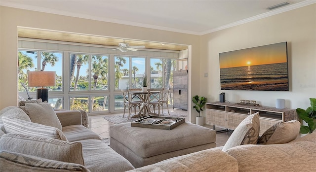 living room featuring ornamental molding, light tile patterned floors, and ceiling fan