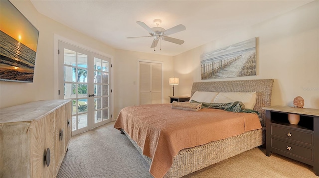 bedroom with light colored carpet, ceiling fan, access to exterior, french doors, and a closet