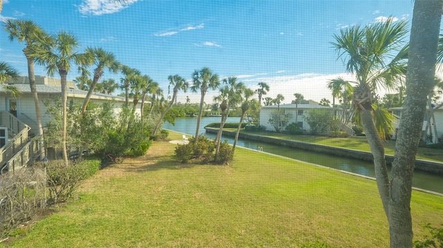 exterior space with a lawn and a water view