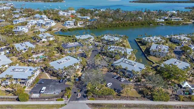 bird's eye view with a water view and a residential view