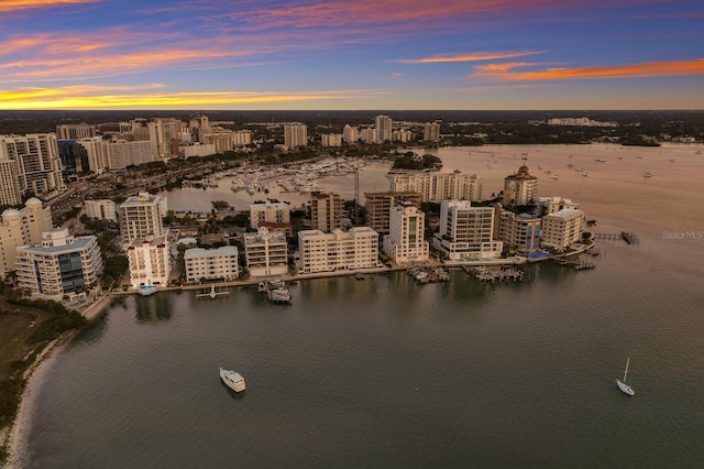 aerial view at dusk with a water view