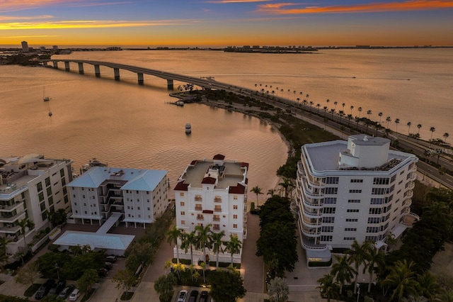 aerial view at dusk with a water view