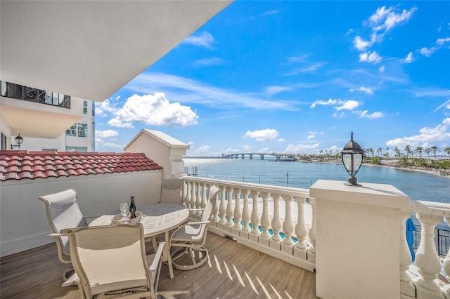 balcony featuring a water view