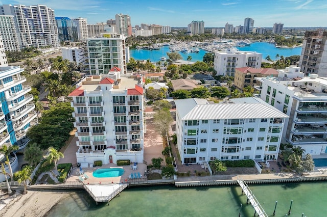 birds eye view of property with a water view