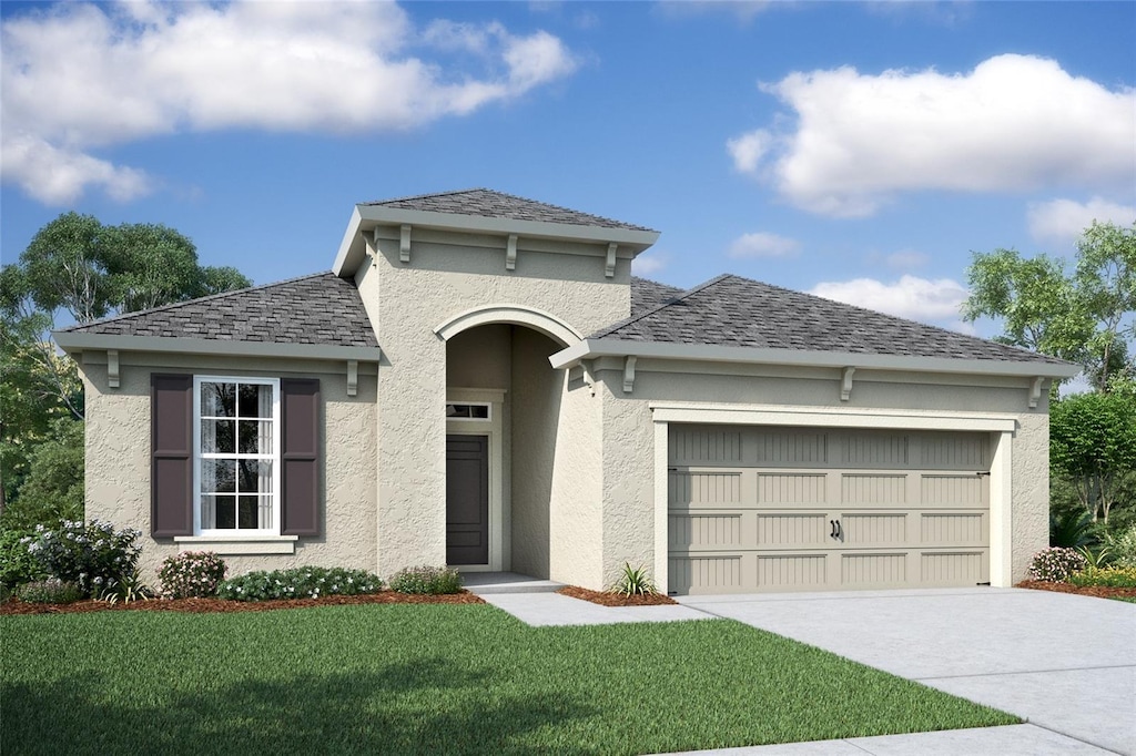 view of front facade featuring a garage and a front yard