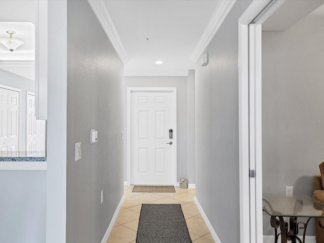 corridor featuring ornamental molding and light tile patterned floors