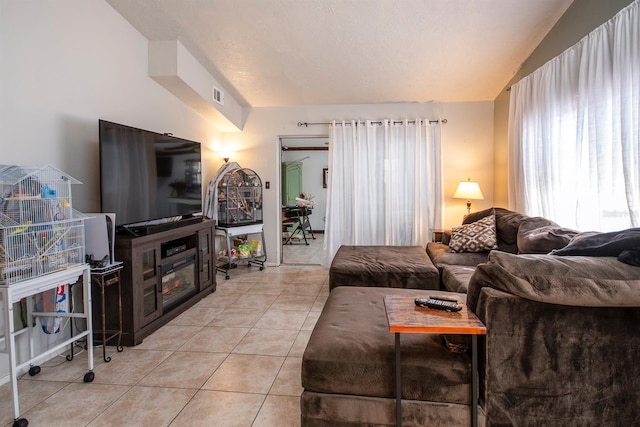 tiled living room with lofted ceiling