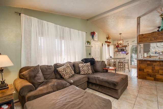 living room with light tile patterned flooring and lofted ceiling with beams