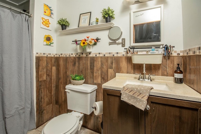 bathroom with toilet and vanity