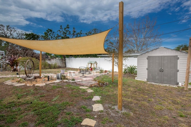 view of yard with a patio area and a shed