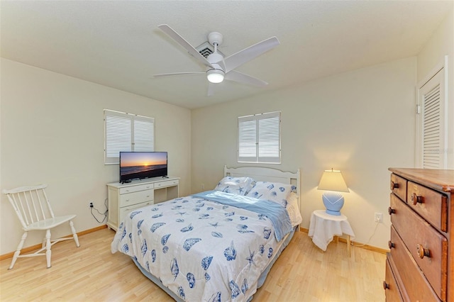 bedroom featuring light wood-type flooring and ceiling fan