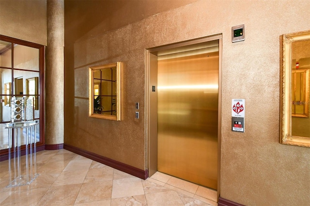 hallway featuring elevator