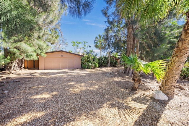 view of yard featuring a garage