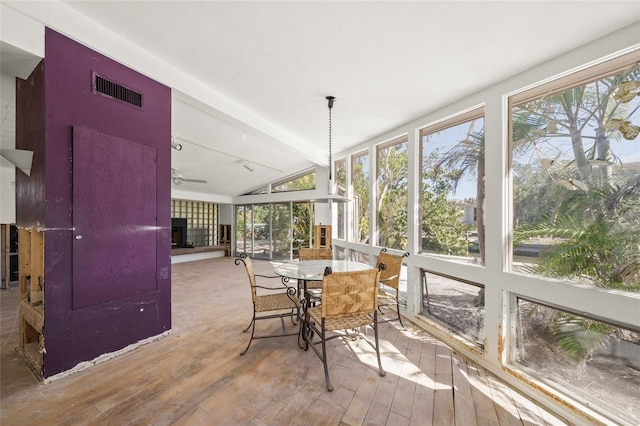 sunroom with lofted ceiling with beams