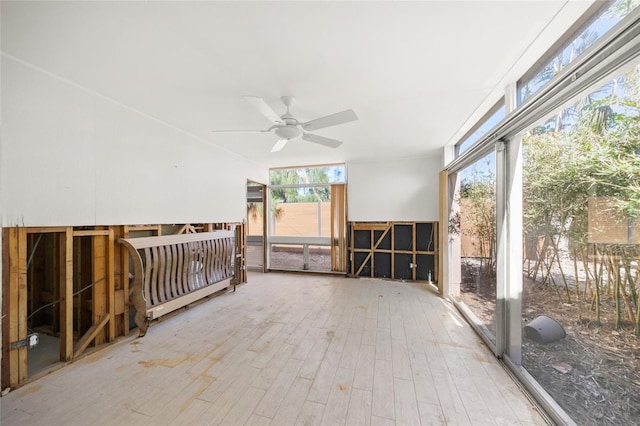 interior space featuring hardwood / wood-style floors and ceiling fan