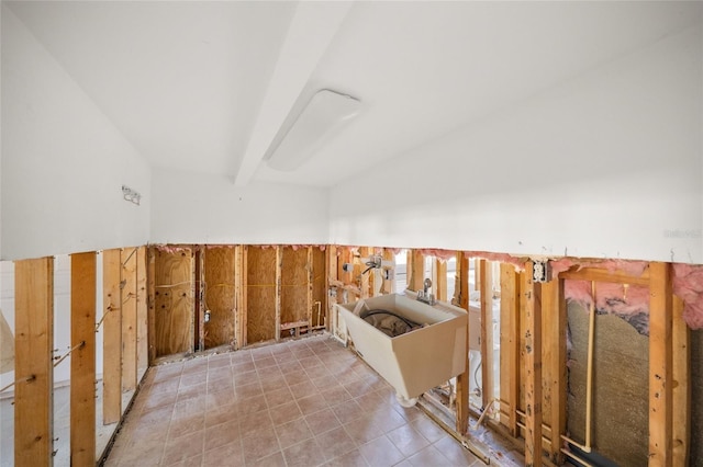 interior space featuring beamed ceiling