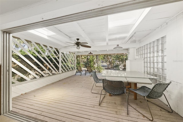 wooden deck featuring ceiling fan