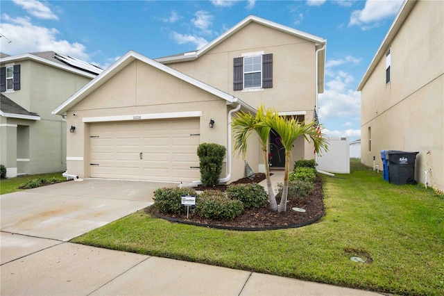 view of front property featuring a garage and a front lawn