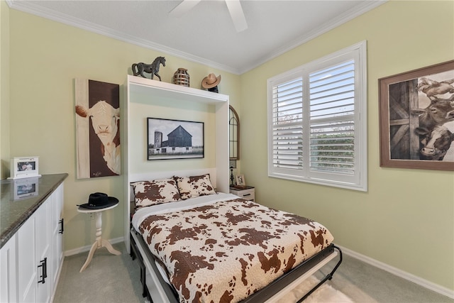 carpeted bedroom with crown molding and ceiling fan