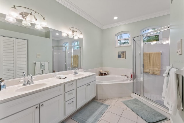 bathroom with shower with separate bathtub, tile patterned floors, and vanity