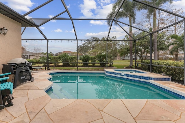 view of swimming pool with grilling area, a patio area, glass enclosure, and an in ground hot tub