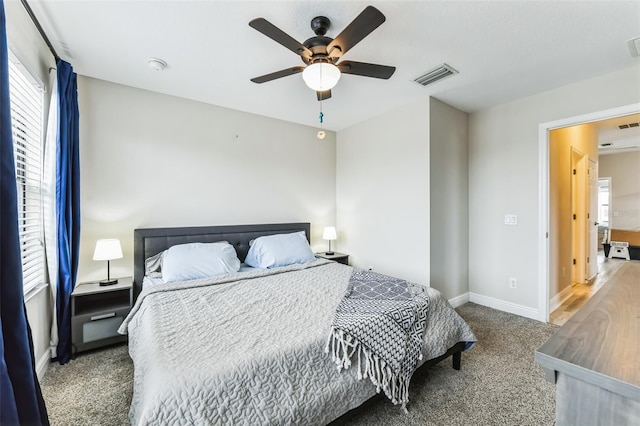 bedroom featuring ceiling fan and carpet