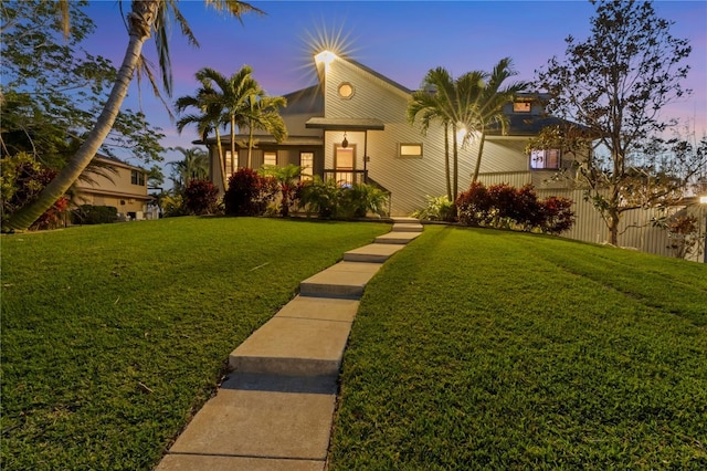 view of front of property with a lawn