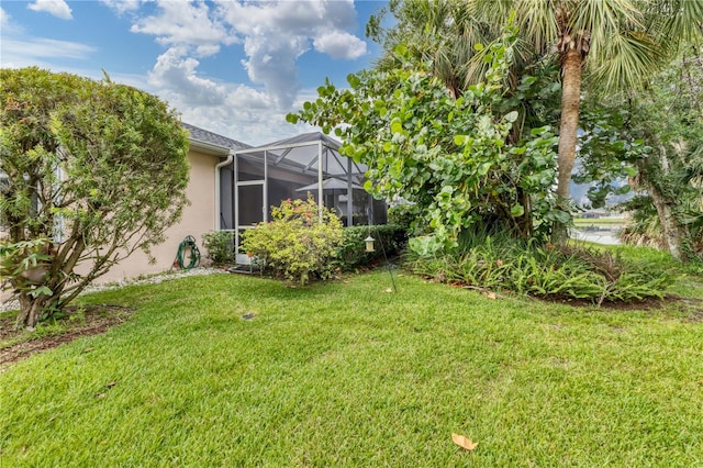 view of yard with a lanai