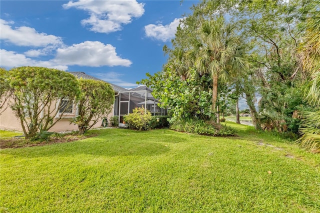 view of yard with a lanai