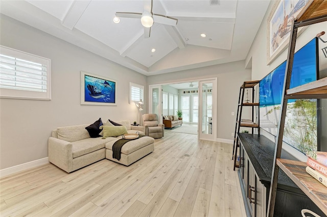 living room with ceiling fan, high vaulted ceiling, beam ceiling, and light hardwood / wood-style floors