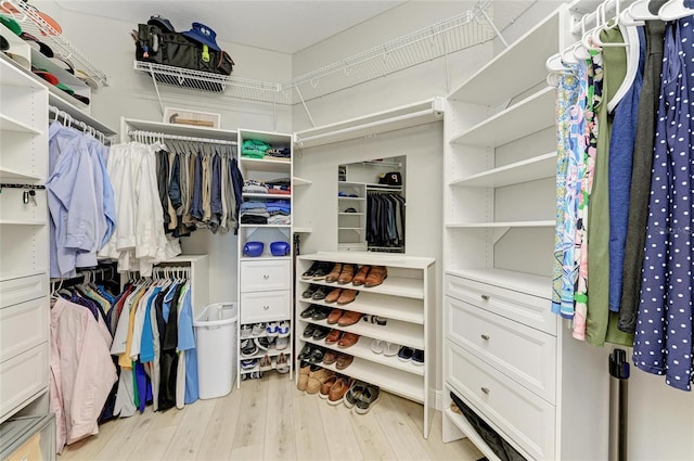 walk in closet featuring light hardwood / wood-style floors