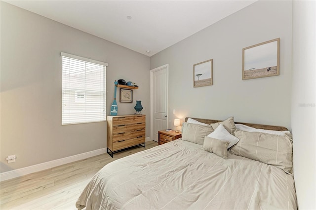 bedroom with light hardwood / wood-style flooring