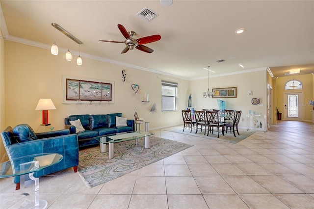 living room featuring light tile patterned flooring, ornamental molding, and ceiling fan