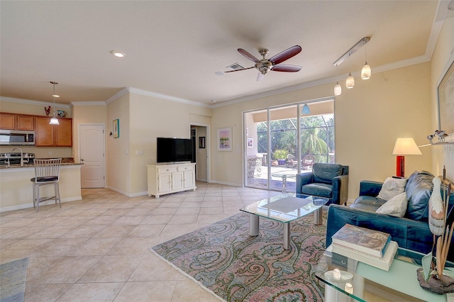 tiled living room with ornamental molding and ceiling fan