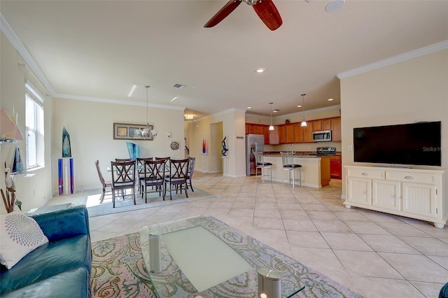 tiled living room with ceiling fan and ornamental molding