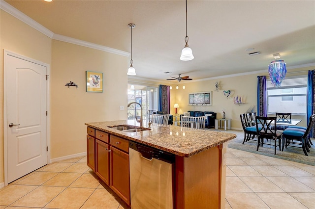 kitchen with light tile patterned flooring, sink, stainless steel dishwasher, an island with sink, and light stone countertops