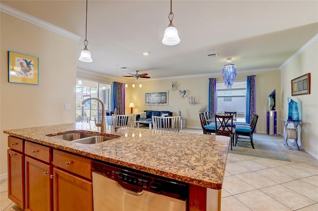 kitchen with pendant lighting, sink, dishwasher, ornamental molding, and a center island with sink