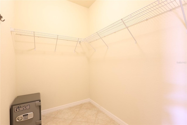 spacious closet with tile patterned flooring