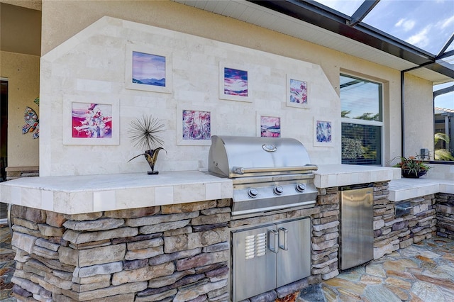 view of patio / terrace featuring area for grilling and an outdoor kitchen